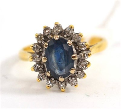 Lot 61 - Sapphire and diamond cluster ring