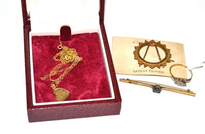 Lot 64 - A bar brooch, a coin holder brooch, a diamond three stone twist ring, pendants, chains etc