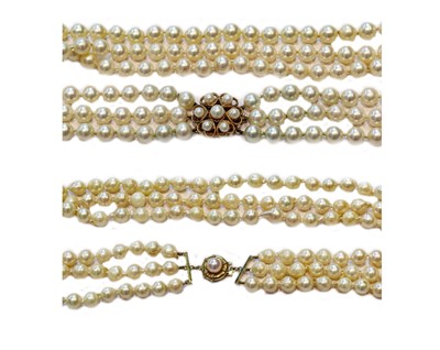 Lot 225 - A three row cultured pearl necklace knotted to...