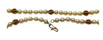 Lot 209 - A baroque cultured pearl necklace spaced by...