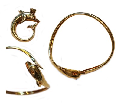 Lot 200 - A dolphin bangle stamped '585'; and a dolphin...