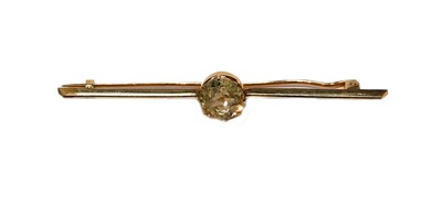 Lot 202 - A yellow sapphire bar brooch, unmarked, length...