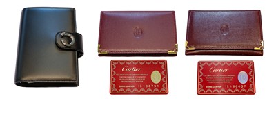 Lot 237 - A Cartier filofax; a Must de Cartier lighter;...