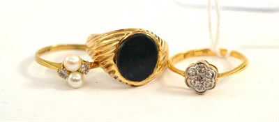 Lot 77 - A diamond cluster ring, a bloodstone ring and a dress ring (3)