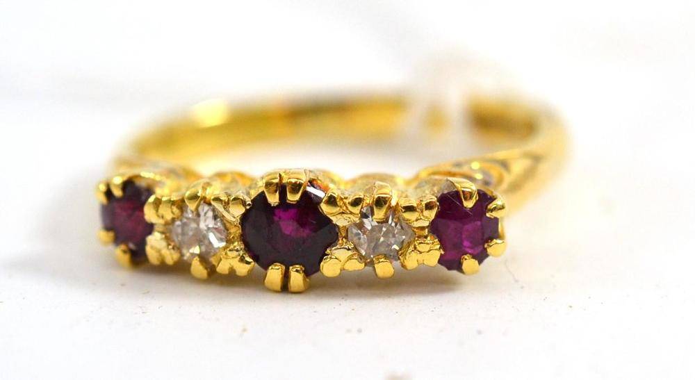 Lot 81 - An 18ct gold ruby and diamond five stone ring