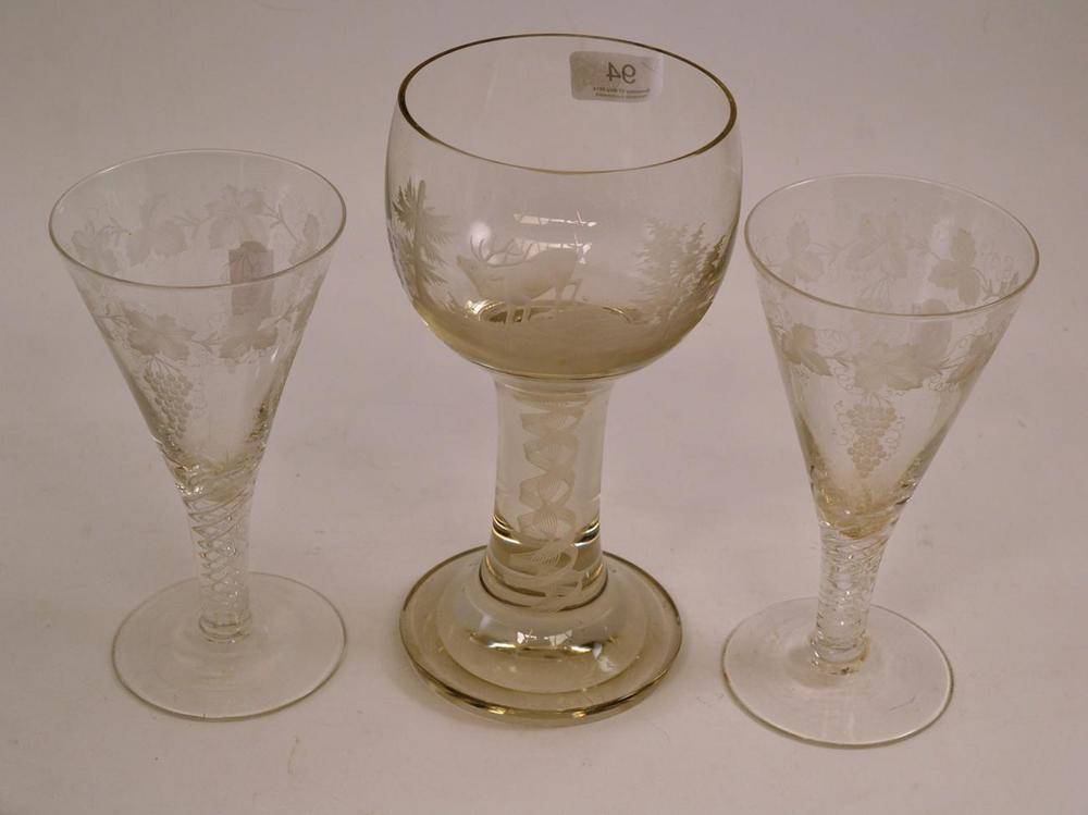 Lot 94 - Bohemian glass goblet engraved with a stag and two 18th century style trumpet shaped flutes...