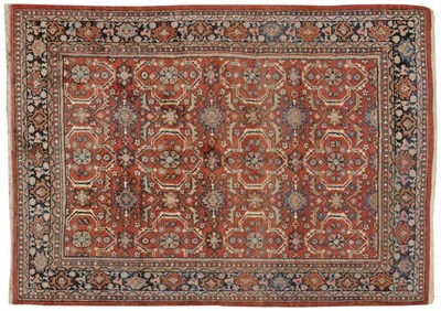 Lot 1107 - Mahal Carpet West Persia The madder field with columns of skeletal cruciform medallions linked...