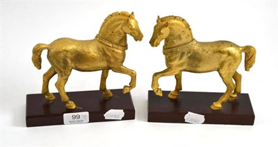 Lot 99 - Pair of gilt bronze figures of horses on plinth bases