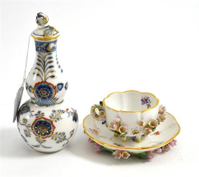 Lot 103 - A Meissen encrusted cabinet cup and saucer, a Meissen double gourd bottle and stopper (a.f.)