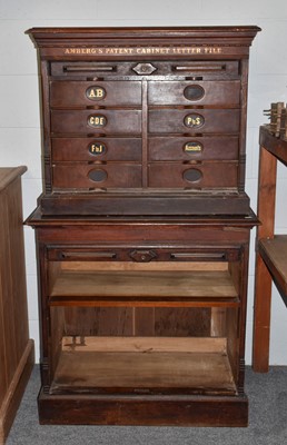 Lot 1213 - A late Victorian stained oak tambour fronted...