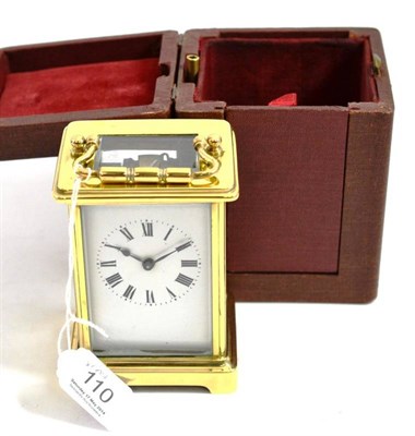 Lot 110 - Brass cased carriage clock in fitted leather case and key