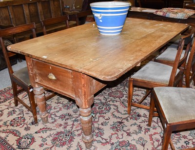 Lot 1302 - A Welsh pine farmhouse kitchen table with...