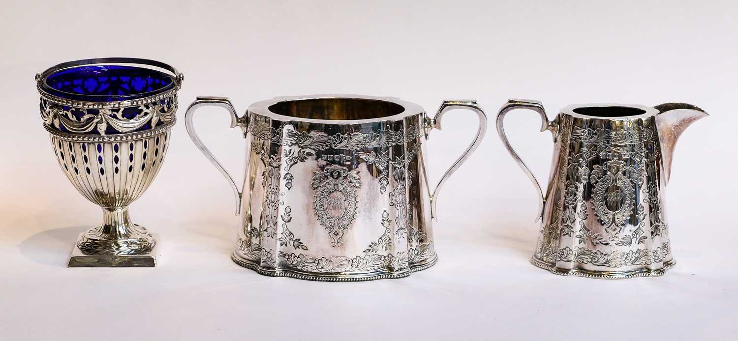Lot 27 - A silver blue glass lined sugar basket, four...