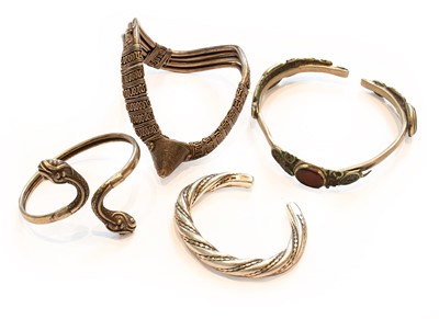 Lot 270 - Four Yemen/Arab silver bangles, one worked as...