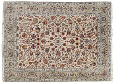 Lot 1109 - Good Kashan Carpet The ivory field with an allover design of palmettes and scrolling vines enclosed