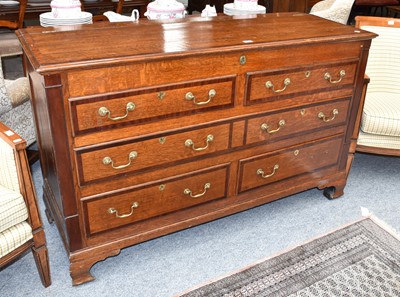 Lot 1259 - A George III crossbanded oak mule chest,...