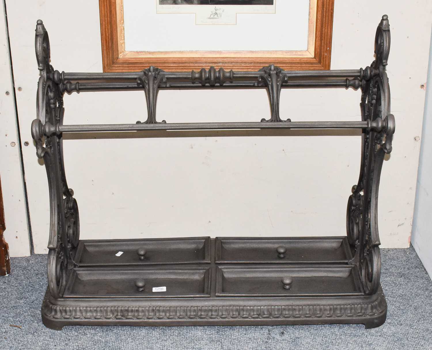 Lot 1256 - A reproduction patinated cast iron stick stand...