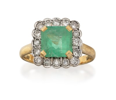 Lot 2299 - An Emerald and Diamond Cluster Ring