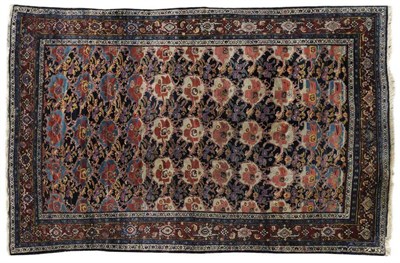 Lot 1112 - Unusual Senneh Carpet Persian Kurdistan The deep indigo field with a design of stylised flowerheads