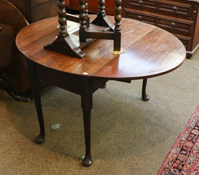 Lot 1326 - An 18th century mahogany drop leaf table with...