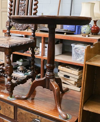 Lot 1329 - A George III mahogany circular tilt top tripod...