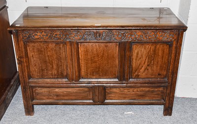 Lot 1307 - An eighteenth century carved oak three panel...