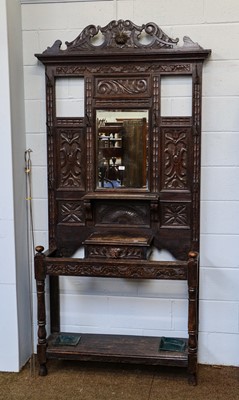 Lot 1394 - A late Victorian carved oak hall stand, 105cm...