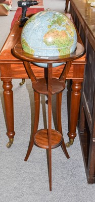 Lot 1248 - A 20th century revolving globe on mahogany stand