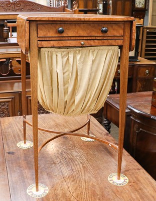 Lot 1342 - An early 19th century satinwood work table