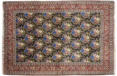 Lot 1115 - Tabriz Carpet Persian Azerbaijan The deep indigo field with an allover lattice design of...