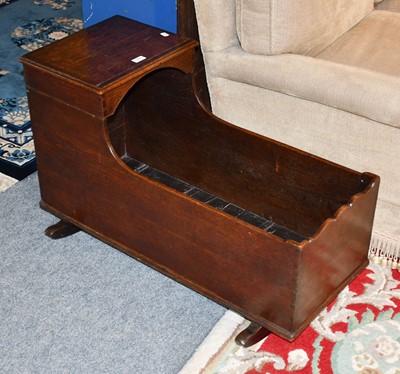 Lot 1231 - An early 19th century oak cradle on rocker...