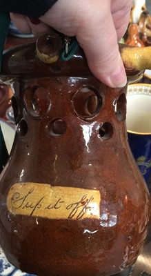 Lot 18 - A slipware puzzle jug, 18th Century pearlware...