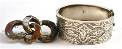 Lot 202 - Silver bangle and a Scottish hardstone brooch