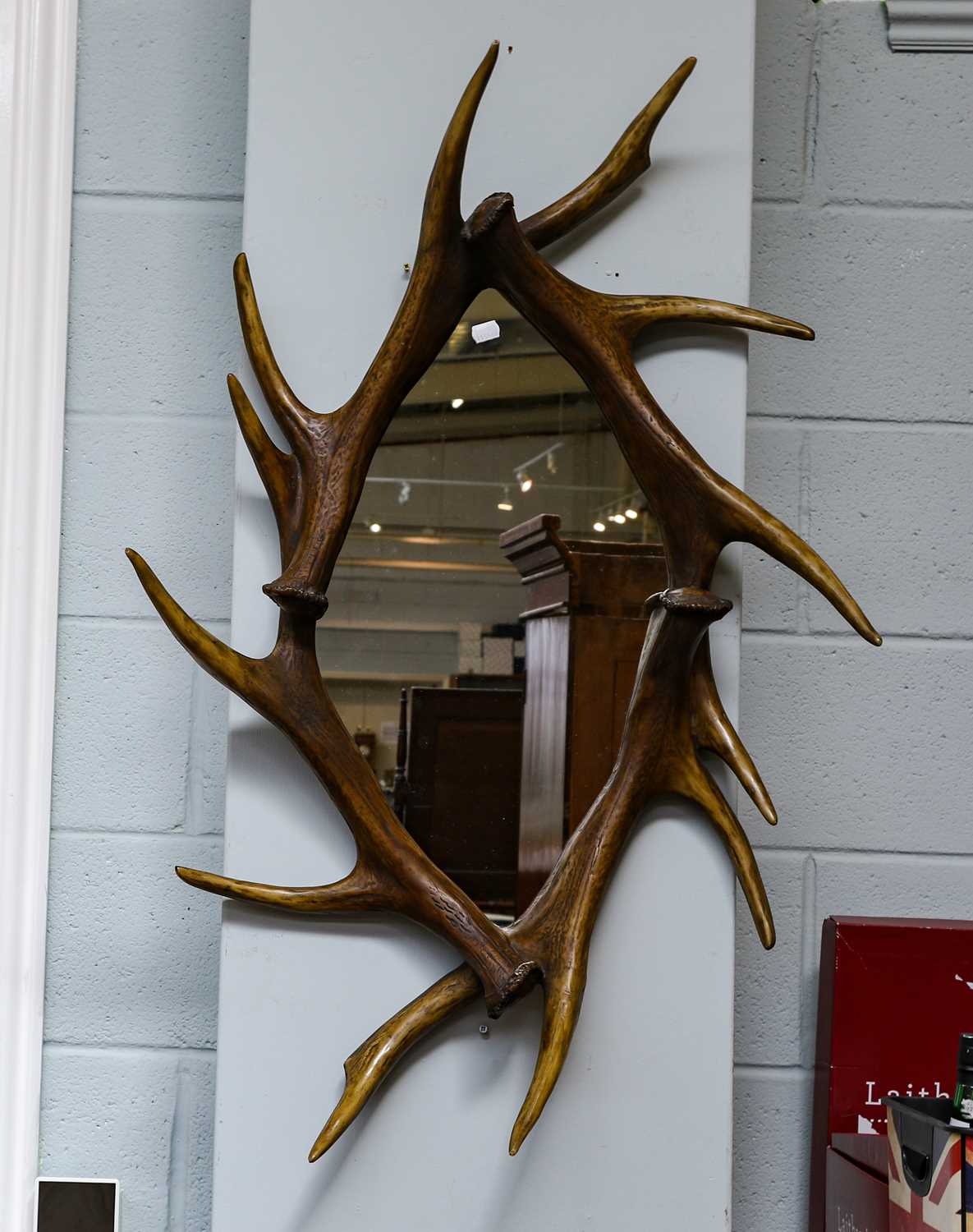 Lot 1329 - A Faux Deer antler mounted wall mirror