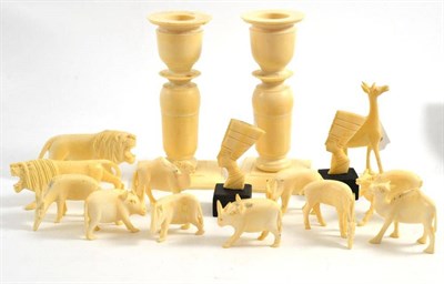 Lot 209 - A pair of pre-1947 ivory candlesticks and assorted ivory animals