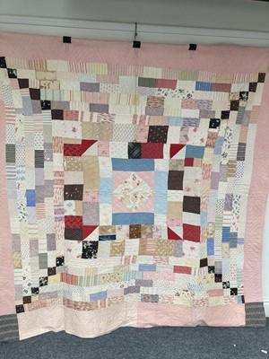 Lot 2177 - 19th Century Patchwork Quilt, with a central...