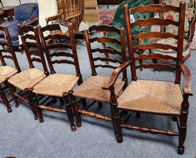 Lot 1256 - A set of eight rush seated oak Lancashire...