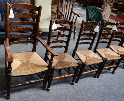 Lot 1256 - A set of eight rush seated oak Lancashire...