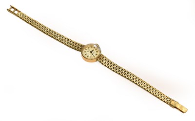 Lot 194 - A lady's 14 carat gold wristwatch, signed...