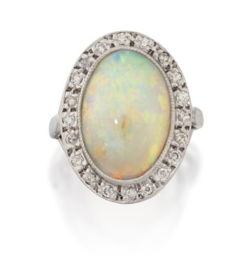Lot 2287 - A 14 Carat White Gold Opal and Diamond Cluster Ring