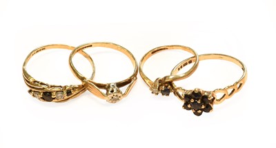 Lot 239 - Four 9 carat gold gem-set rings including a...