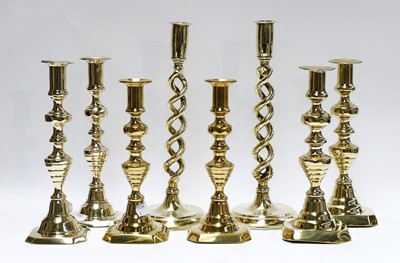 Lot 47 - Five pairs of brass candlesticks including...