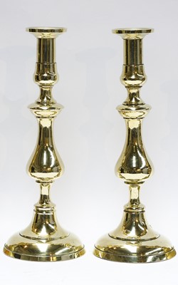 Lot 47 - Five pairs of brass candlesticks including...