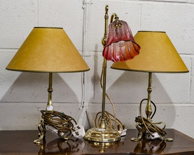 Lot 388 - An early 20th century brass rise and fall lamp...