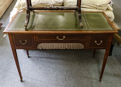 Lot 1411 - A leather-topped inlaid mahogany writing table,...