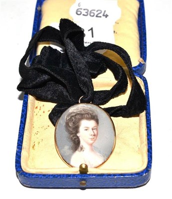 Lot 231 - A Victorian gold brooch/pendant set with a portrait miniature of a lady