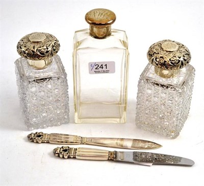 Lot 241 - Two Asprey's silver mounted dressing table bottles, another bottle and a pair of Georg Jensen...