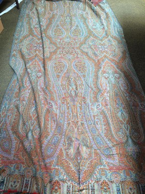 Lot 335 - A large late 19th century woven paisley throw,...