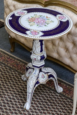 Lot 1381 - A 20th century porcelain circular tripod table,...