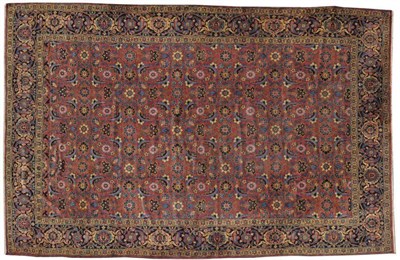 Lot 1122 - Veramin Carpet Central Persia The soft raspberry field with an allover design of scrolling serrated